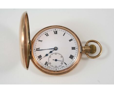 A 9CT. GOLD HALF HUNTING CASED POCKET WATCH the white enamel dial with Roman numerals and subsidiary seconds dial, 50mm. dia.