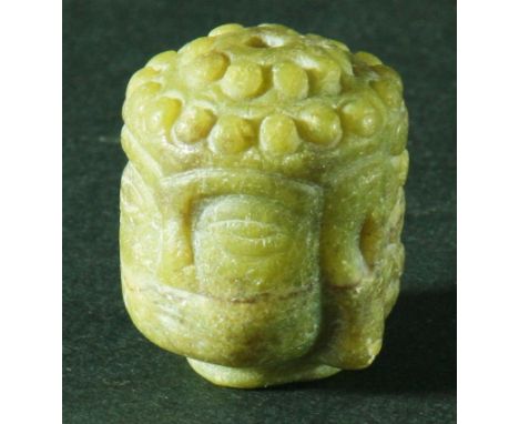 CHINESE YELLOW GREEN JADE HEAD OF A BUDDHA, height 2.8cm, diameter 2.3cm