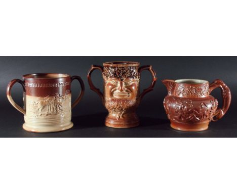 DERBYSHIRE SALTGLAZED LOVING CUP, 19th century, possibly Chesterfield, modelled with a satyrs mask to each side, on a  footed
