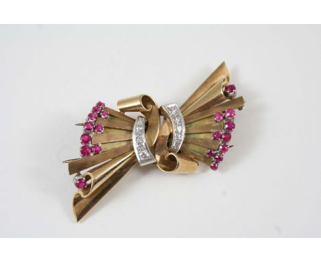 A GOLD AND GEM SET DOUBLE CLIP BROOCH the gold stylised bow design brooch is set with graduated single-cut diamonds and circu