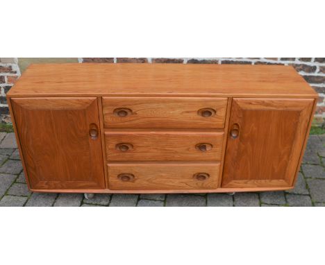 Retro light Ercol sideboard on castors (one handle has a clean brake - piece included) L 156cm D 44cm Ht 69cm