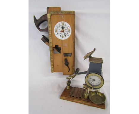2 unique clocks one with woodworking tools and one with brass aeroplanes and Alexanderwerk frame