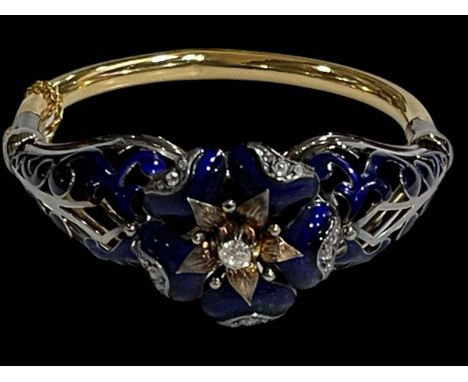 Impressive 18 carat gold, diamond and blue enamel bangle, having elevated 0.25 carat diamond at the centre of the enamelled s