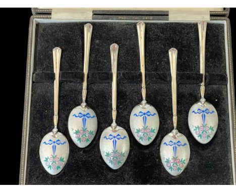 Boxed set of six silver and enamel coffee spoons.