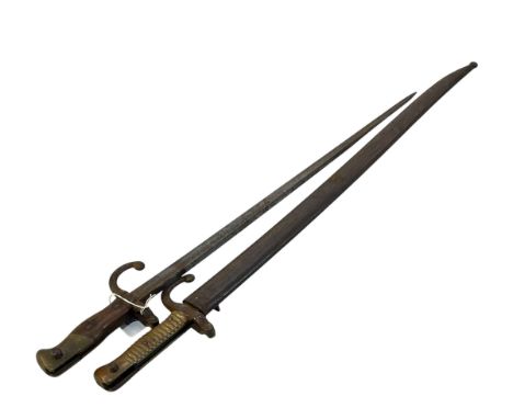 French bayonet and scabbard marked 'Tulle Juin 1811,' handle marked T 8533, blade is 57cm. And another bayonet (no scabbard) 