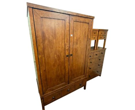 Contemporary hardwood five piece bedroom suite comprising double door wardrobe with base drawer, chest of seven drawers, pair