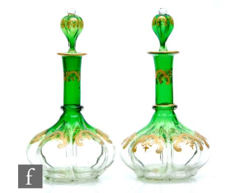 A pair of late 19th Century Moser crystal glass decanters circa 1885, the hexagonal lobed body rising to a slender collar nec