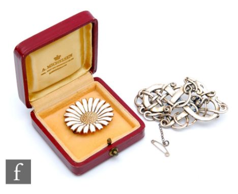 A Danish sterling silver and white enamel daisy pattern brooch, diameter 3.5cm, in original box, some damage, with a Scottish