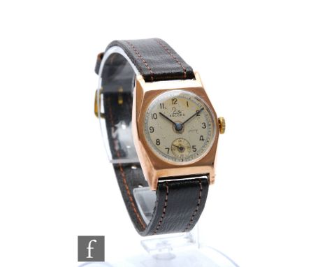 A 9ct hallmarked rose gold Record manual wrist watch, Arabic numerals to a silver dial, case diameter 26mm, to a leather stra