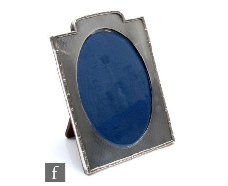 A George V hallmarked silver photograph frame with engine turned decoration and a reeded border, easel back, 24cm x 18cm, Lon