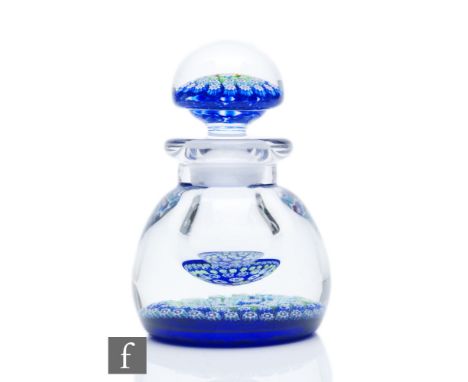 A contemporary John Deacons glass inkwell, of domed form with short collar neck, internally decorated with a central complex 