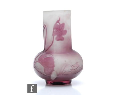 An early 20th century small Galle cameo glass vase of squat ovoid form with tall collar neck, cased in amethyst over frosted 