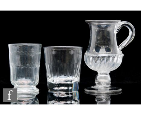 An 18th Century clear crystal glass tankard, circa 1780, of waist form with applied loop handle, with&nbsp;gadrooned basal mo