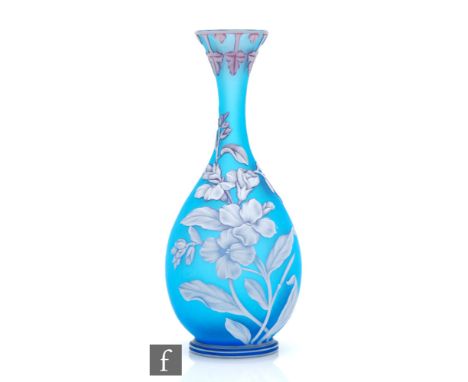 A late 19th Century Thomas Webb &amp; Sons cameo glass vase of footed bottle form with a slender drawn neck and everted rim, 