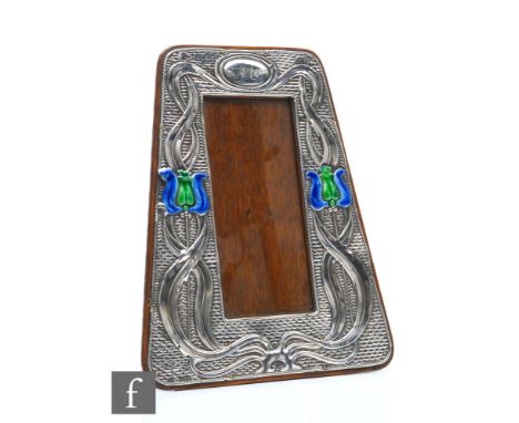 An Edward VII hallmarked silver photograph frame in the Art Nouveau style with two stylised flower heads with sinuous foliage