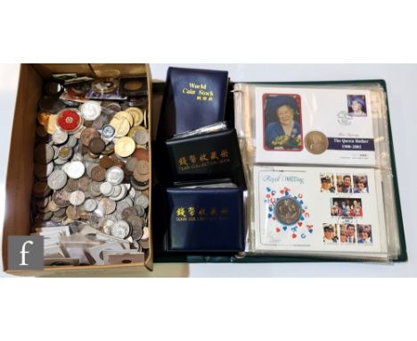 A large quantity of mixed world coinage, nickel, brass and copper with three small albums of coins and a first day cover albu