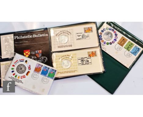 An Elizabeth II album of four Great Britons silver medallic first day covers, a similar 1973 cricket cover and a European Eco