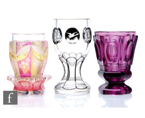 A collection of three late 19th Century Bohemian goblets circa 1880, the first of ovoid form with waisted solid base, decorat