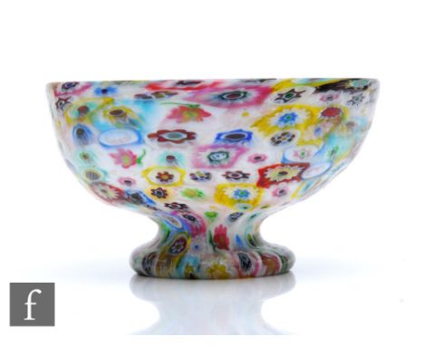 A late 19th Century Venetian Fratelli Toso bowl of circular section raised to a turn over foot,&nbsp;formed of fused millefio