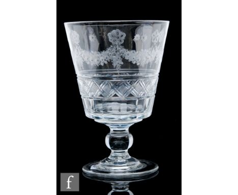 An oversized serving rummer circa 1810, the bucket bowl finely engraved with floral swags with polished centres above a panel