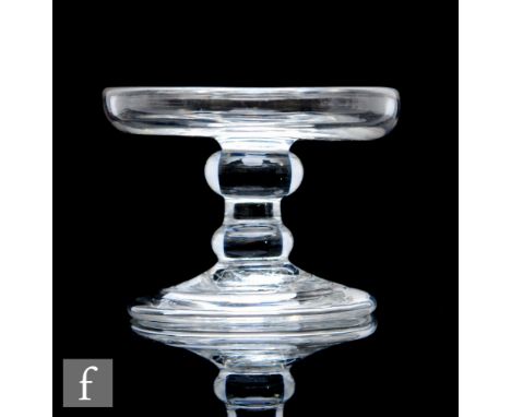 An 18th Century glass patch stand circa 1750, with turned up rim above stem with flattened shoulder knop and basal knop, rais