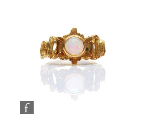 A modern 18ct hallmarked single stone opal ring, circular collar set stone to an abstract pierced border, weight 5g, ring siz