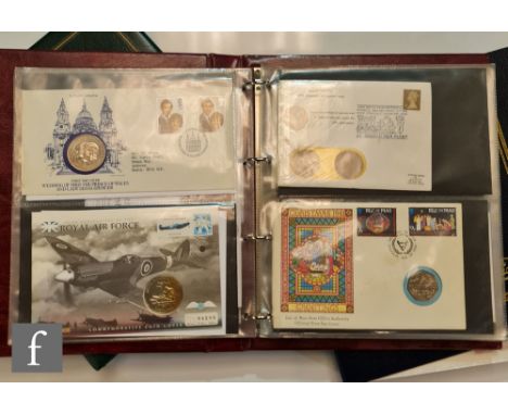 Two Elizabeth II albums of first day issue coin covers and an album first day covers, a sheet of stamps and forty crown, five