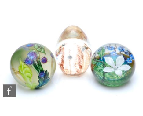 A contemporary Station Glass paperweight designed by Richard P. Golding, of domed form, internally decorated with a large whi