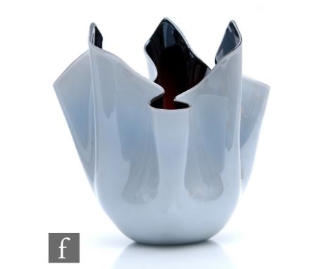 A post war Venini fazzoletto vase of handkerchief form, decorated with a pearlised opal over a black interior, three line aci