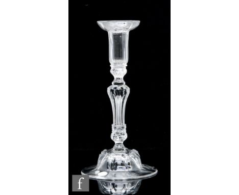 An 18th Century glass candlestick circa 1740, with rib moulded drip pan over a beaded knop and collar above an eight sided Si
