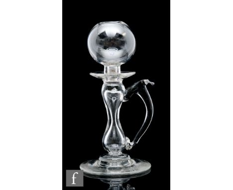 An 18th Century lace makers lamp circa 1800, the spherical top above a hollow baluster form stem with attached loop handle, r