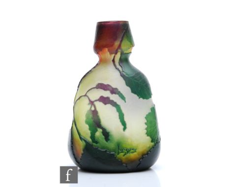 An early 20th Century Legras cameo glass vase, of shouldered tapered ovoid form with cup rim, cased in deep purple and green 