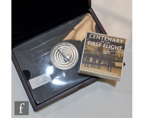 An Elizabeth II Australia Centenary of the First Flight, two ounce silver propeller coin and a 2003 Concorde G-BOAC commemora