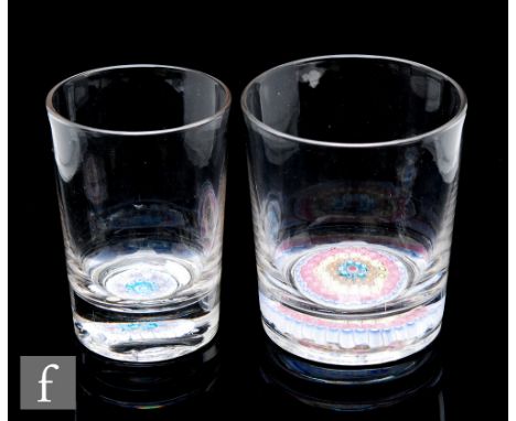 A late 19th Century glass tumbler with an Old English millefiori paperweight base with concentric rings of ruffle and cog can