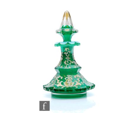 A 19th Century Bohemian Biedermeier crystal glass scent bottle circa 1850, cased in apple green over an opal interior, the lo