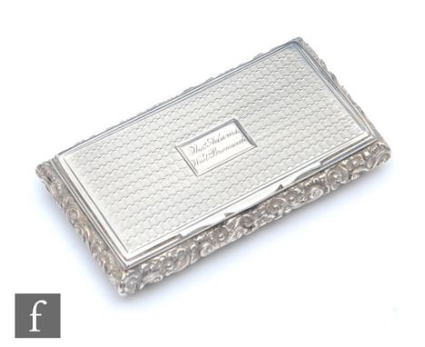 A William IV hallmarked silver rectangular snuff box, engine turned decoration and raised foliate borders, weight 56g, length