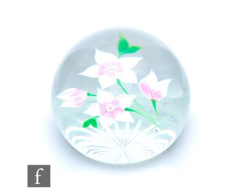 A Caithness Whitefriars glass paperweight, of domed form, in the Candida pattern, internally decorated with lampwork stylised