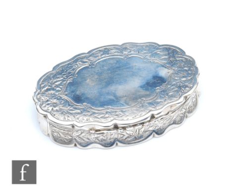 A Victorian hallmarked silver oval snuff box with foliate engraved shaped border with central vacant cartouche, weight 65.5g,