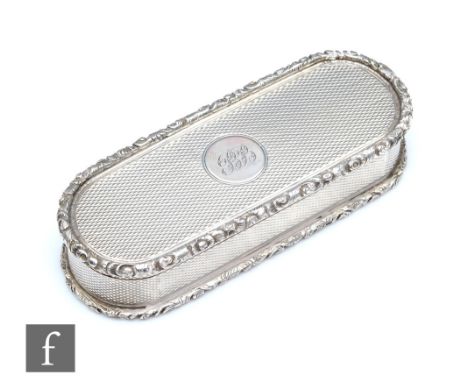 A William IV hallmarked silver oval snuff box with raised foliate border encompassing central engine turned decoration, weigh