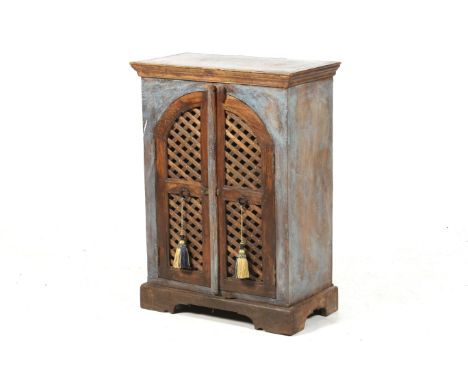 A small hardwood cabinet. The two doors featuring pierced decoration and ring handles, the exterior roughly painted blue, rai