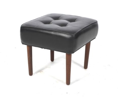 A mid-century dressing table stool. With a padded black vinyl button seat, on turned tapering supports. L37cm x D37cm x H35cm
