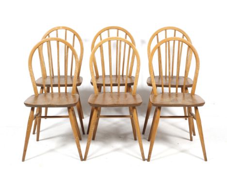 A set of six mid-century Ercol dining chairs. With curved backs, raised on turned tapering supports, H86cm