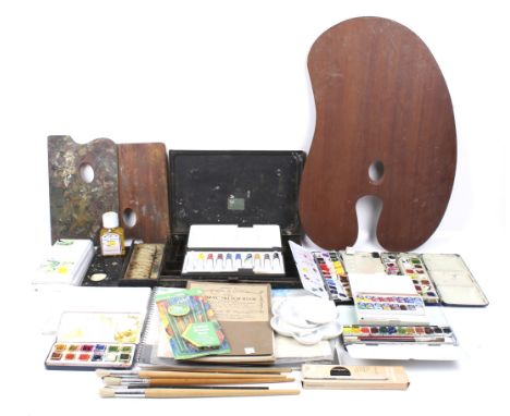 An assortment of artist materials. Including ceramic palettes, watercolour sets, paintbrushes, sketch books, etc.