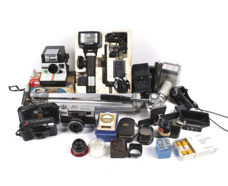 An assortment of cameras and accessories. Including a Polaroid 1000, a Fujica 35 and a Canon Sure Shot, a tripod, etc.