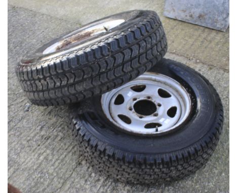 Two spare truck wheels with Bridgestone tyres. Comprising one Dueler H/T 235 / 75 R 15 105 T and M+S LT245 / 75 R. 16