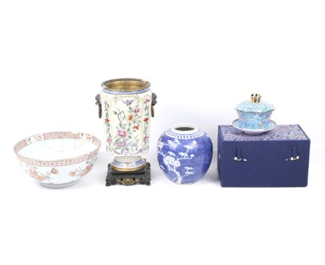 A collection of four assorted Chinese ceramic items. Including a prunus jar, an 18th century Chinese bowl (AF), a mounted vas