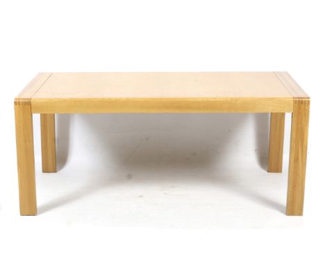 A contemporary Ercol Bosco extending table. Raised on block supports, full size L225cm x D90cm x H74cm