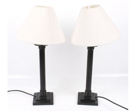 A pair of black painted metal table lamps. On a square two step base. H52cm