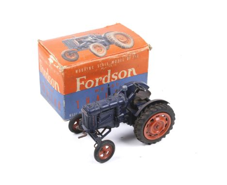 A Chad Valley diecast Fordson Major E27N major tractor. Complete with crank and in original box. Box complete with two intern