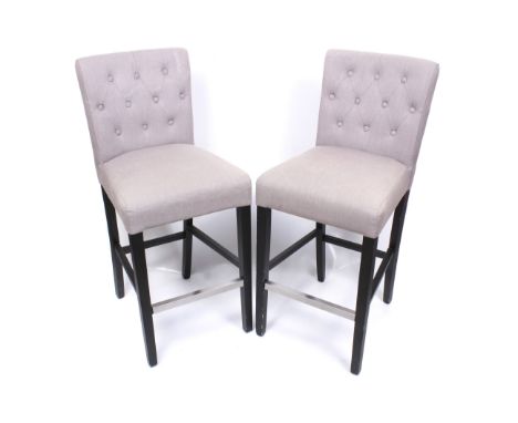 A pair of wood framed grey upholstered button back bar stools. H105cm